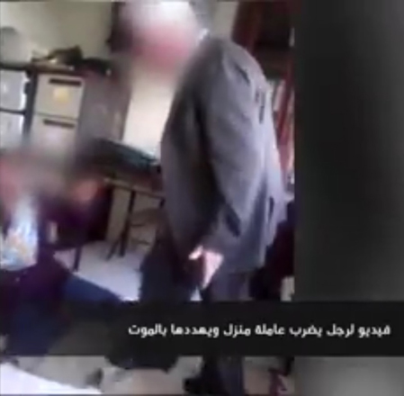 In this image grab taken from a video posted on YouTube, a man is seen purportedly kicking a domestic helper